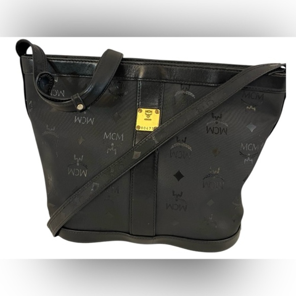 MCM black coated canvas crossbody bag with leather trim-Inside has dry peeling